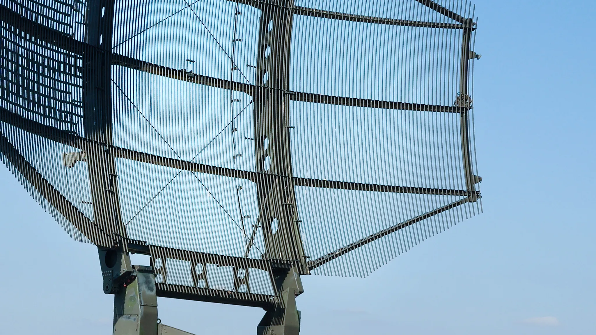 MILITARY ANTENNA/SIGNAL DISH IN FRONT OF A BLUE SKY